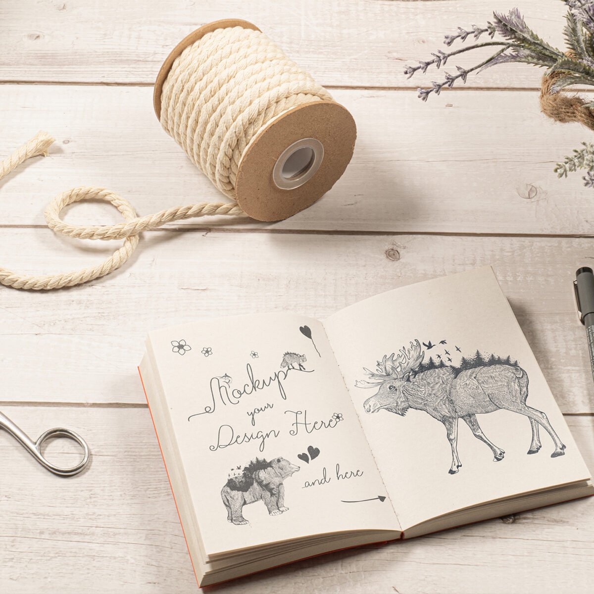 Sketch Notebook Mockup on a White Wood Table with Ornaments