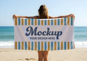 Blank Beach Towel Mockup Held by Woman on Sandy Shoreline