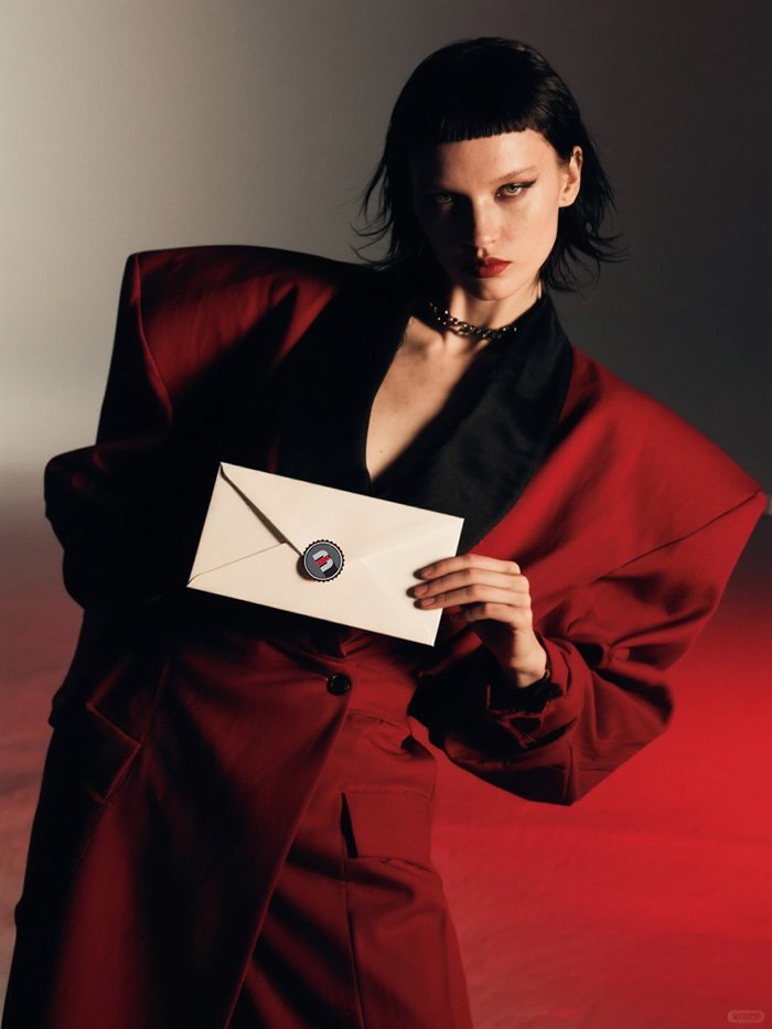 red rebel-editorial-photoshot-film-grain-portrait with mail letter contact