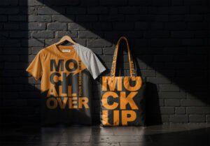 White T-Shirt and Tote Bag Mockup On A Black Brick Wall